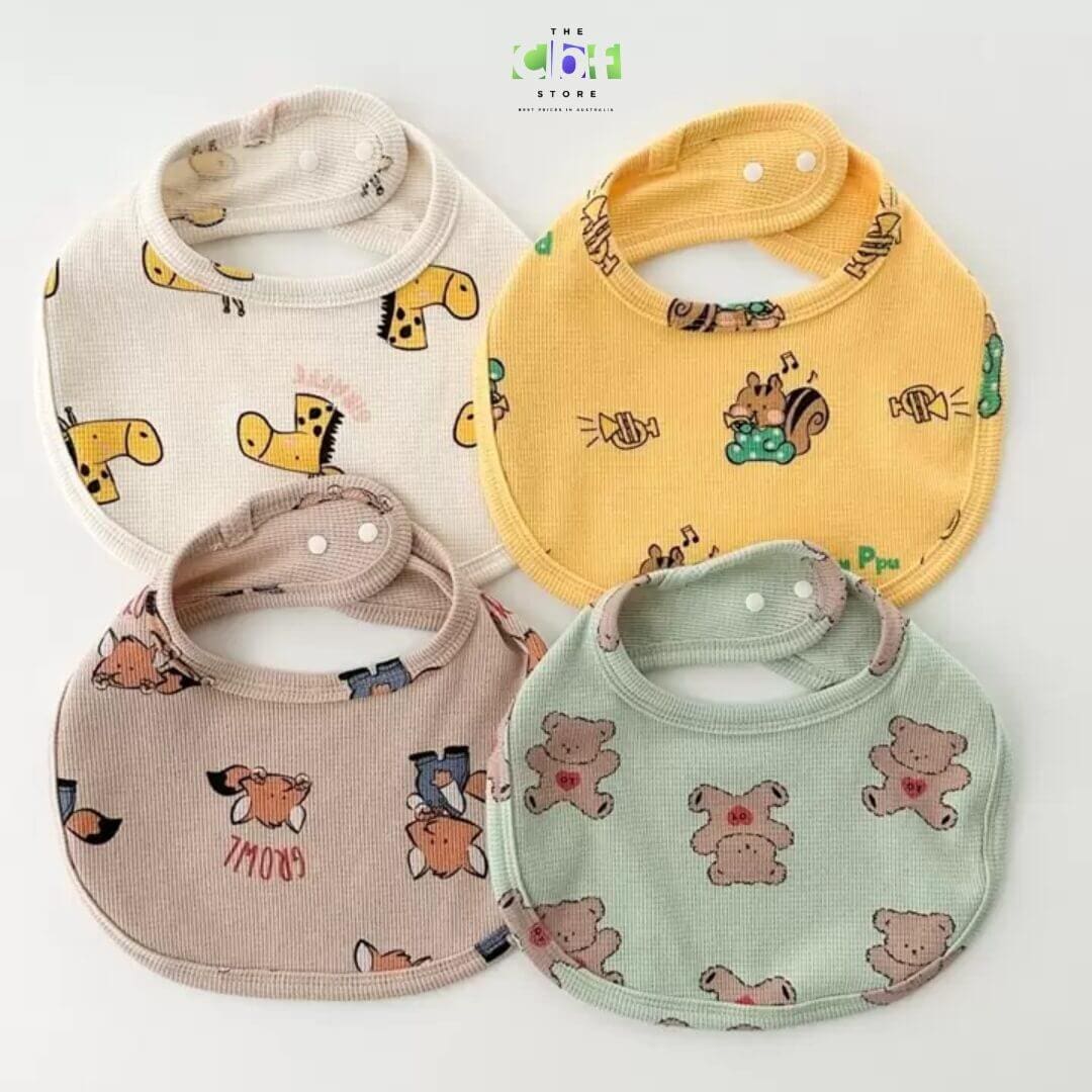 Cute animal bib in cream, beige, mint green and yellow with animal prints